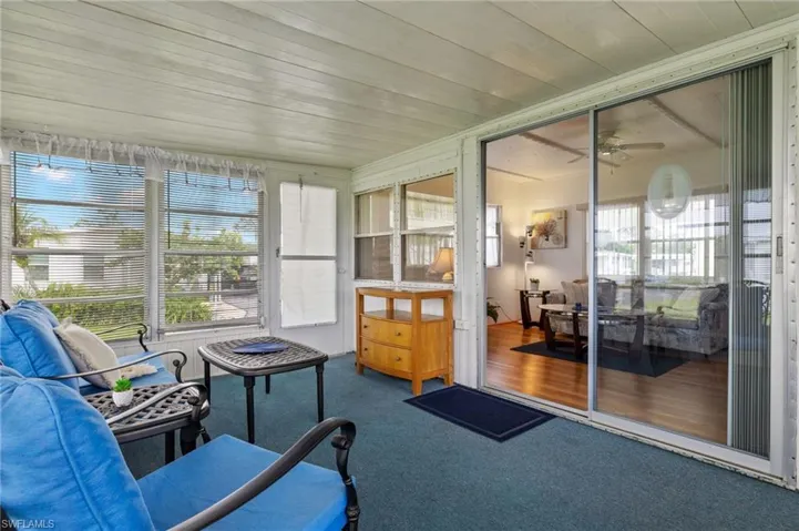 Sunroom / solarium with ceiling fan and a healthy amount of sunlight