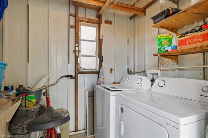 Laundry area featuring washing machine and clothes dryer