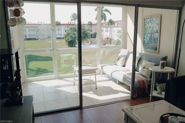 Doorway to outside featuring hardwood / wood-style floors