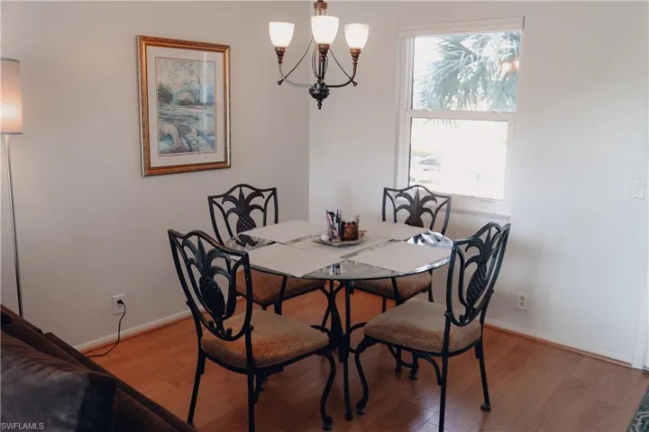 Dining room with a chandelier and light wood finished floors