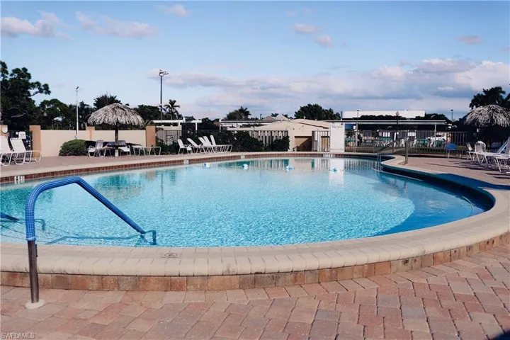 Community pool featuring a patio