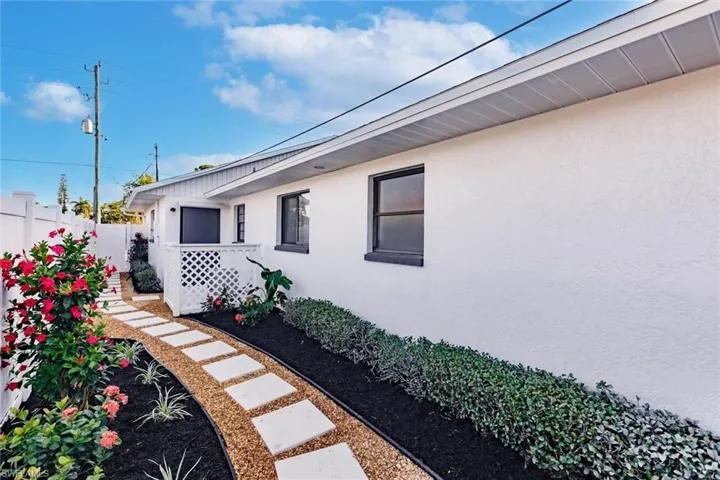 View of property exterior with stucco siding