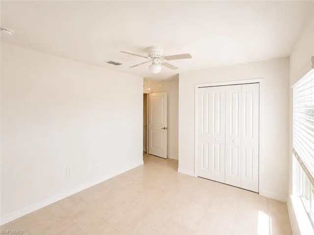 Neutral-toned tile flooring throughout