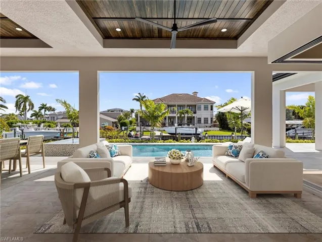 Virtually staged outdoor living area lanai.