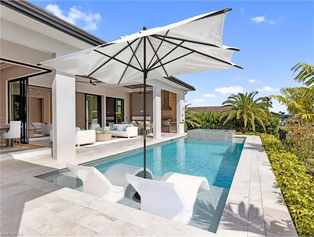 Virtually staged pool and outdoor living area.
