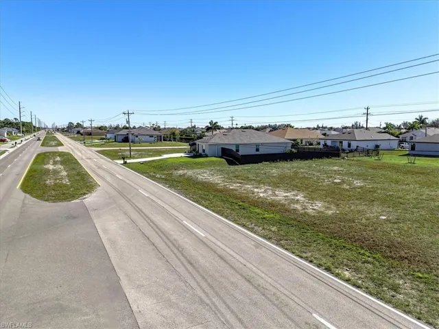 View of asphalt street featuring a residential view