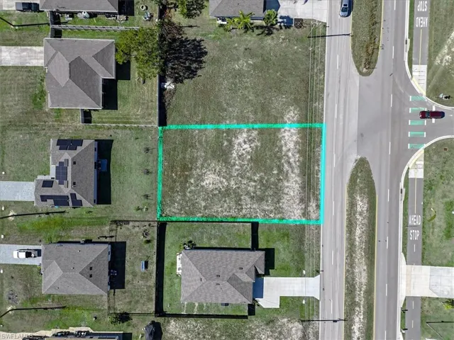 Aerial view of residential area with property parcel outlined