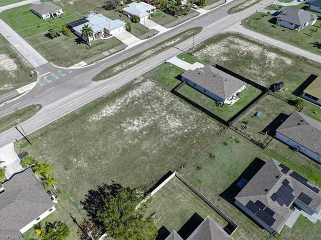 View of property location with nearby suburban area