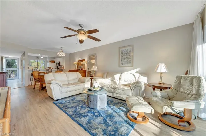 Living room area, looking towards front entry. View 2
