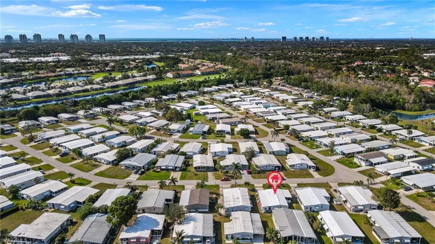 Birds eye view of property with a view of city and a residential view