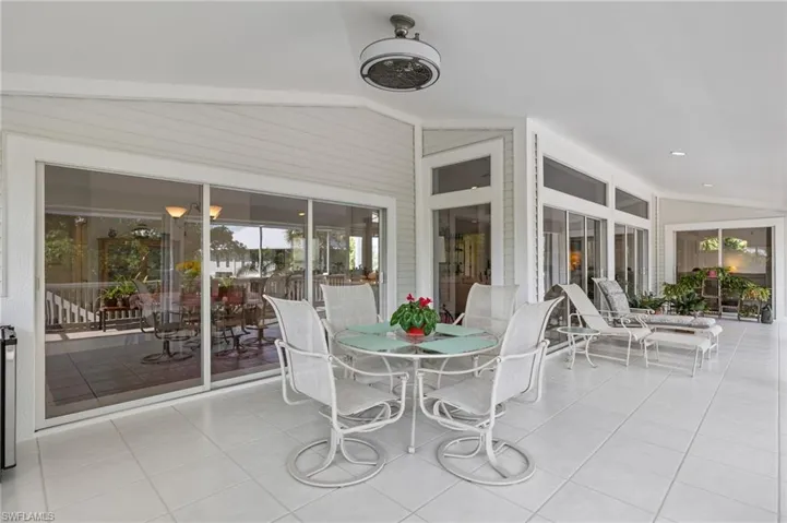 Sunroom featuring vaulted ceiling