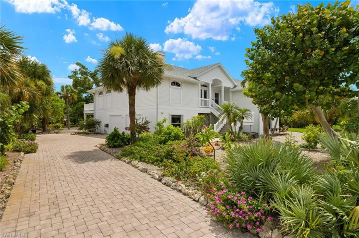 View of property exterior featuring a garage