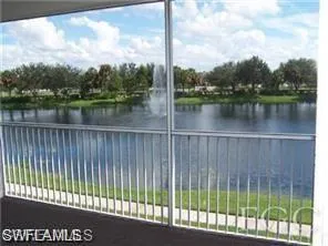 Screened balcony offering lakefront scenery with a fountain feature