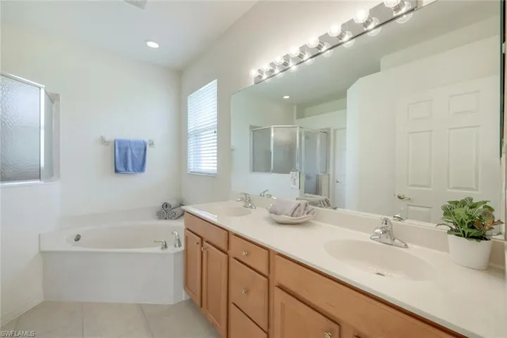 Master bath with soaking tub and shower.