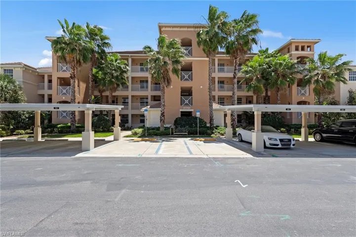 The property features a multi-story building with balconies and a tile roof