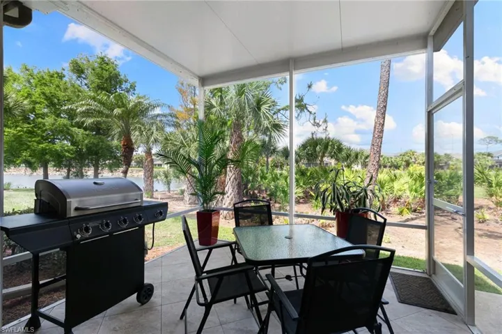 Sunroom / solarium featuring outdoor dining area
