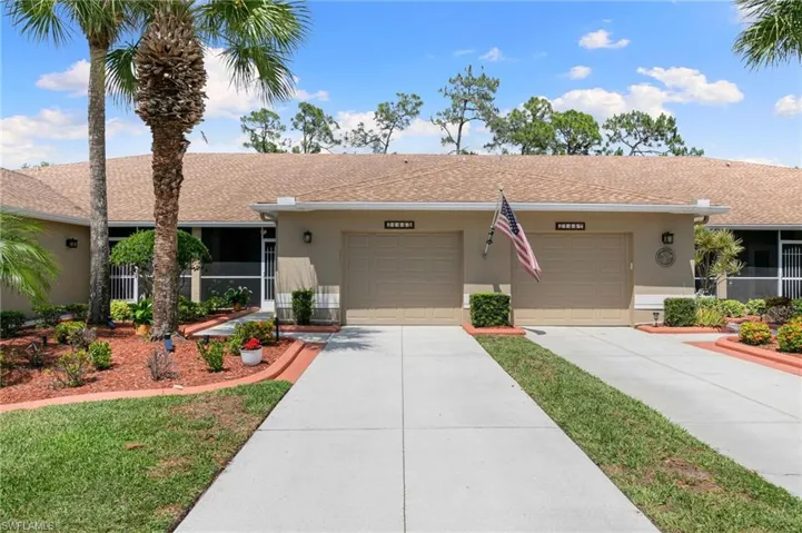 Ranch-style house with roof with shingles, driveway, a garage, and stucco siding