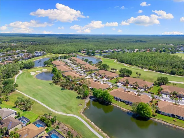 Bird's eye view with a water view, golf course view, a residential view, and a wooded view