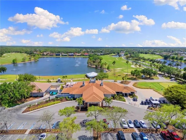 Drone / aerial view with a water view and view of golf course