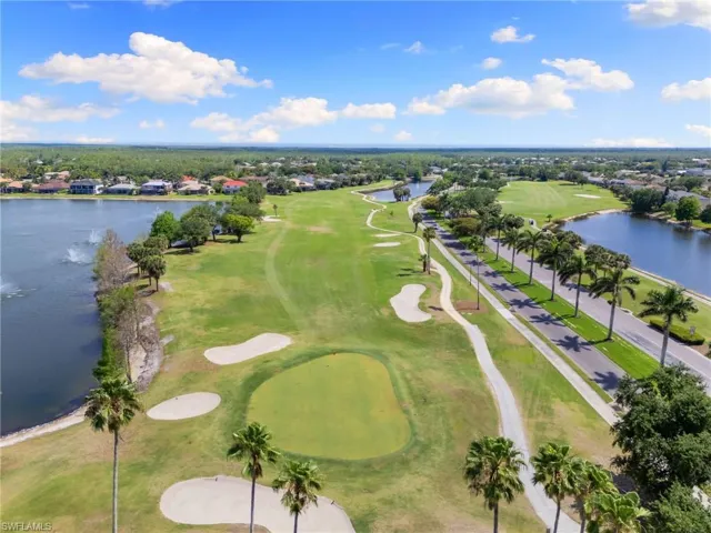 Bird's eye view with a water view and golf course view