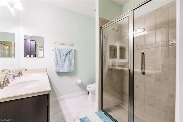 MASTER BATHROOM HAS AN AMAZING WALK IN SHOWER WHICH IS BEAUTIFULLY TILED & COMES EQUIPPED WITH A SAFETY HANDLE BAR!