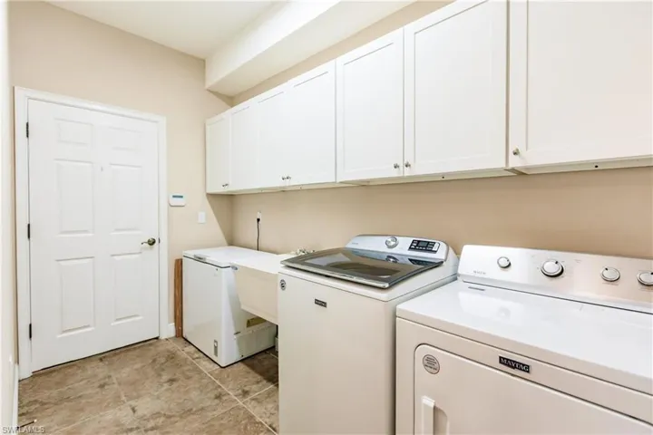 LAUNDRY ROOM IS EQUIPPED WITH NEW MAYTAG WASHER & DRYER! ALSO, THE HOMEOWNER RECENTLY ADDED THE WHITE CABINETS & LAUNDRY TUB! THIS HOME HAS IT ALL.