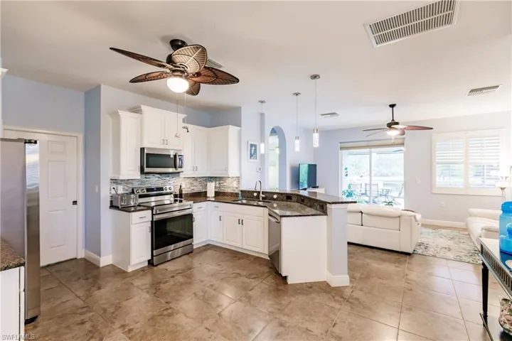 TOTALLY OPEN FROM THE KITCHEN AREA TO THE LIVING ROOM TO ENTERTAIN! TIME TO CALL FAMILY & FRIENDS! THEY WILL BE IMPRESSED!