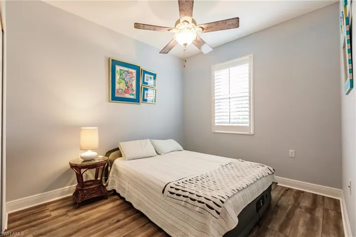 GUEST BEDROOM HAS NEWLY INSTALLED VINYL PLANK WOOD FLOORING=NO CARPET. PLANTATION SHUTTERS & UPDATED FAN W/LIGHTING! EXCELLENT-SIZED GUEST BEDROOM FOR FAMILY & FRIENDS TO ENJOY!