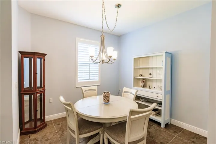 THE DINING AREA HAS A NEW ELEGANT CHANDELIER & PLANTATION SHUTTERS!