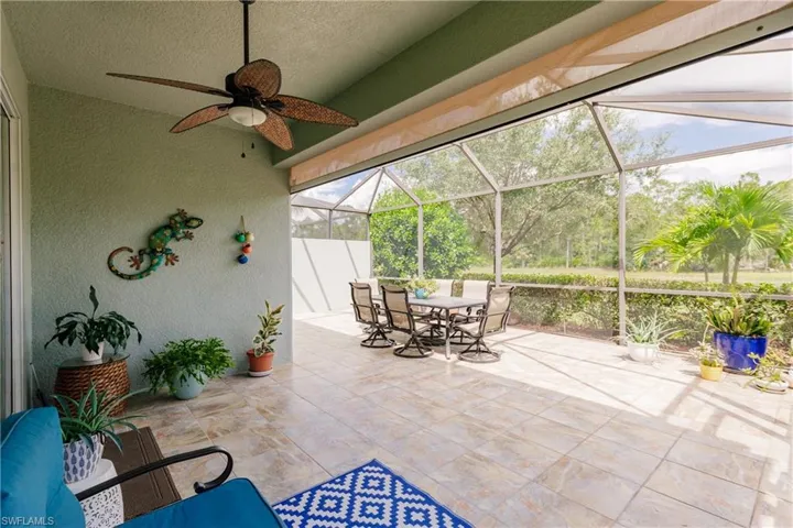 BEAUTIFULLY TILED LANAI W/MEDALLIONS! NOTE THE STORM SMART HURRICANE ELECTRIC SCREENS! YOUR FUTURE HOME & PATIO FURNITURE ARE PROTECTED WHILE YOU ARE AWAY FROM PARADISE!
