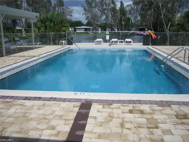 Enjoy AFFORDABLE LIVING in the Sunshine State in this pet-friendly, people-friendly 55+ Community w/shuffleboard, pickle ball, bocce ball, pool, ponds, mature landscaping, street lights.