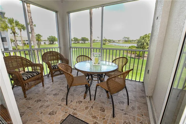 Sunroom with a water view