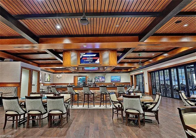 Dining area featuring beamed ceiling and wood finished floors