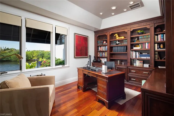Den/office with beautiful wood builtins