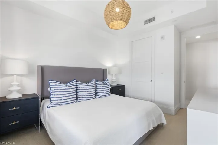 Recessed lighting, wood flooring, and a contemporary woven pendant light fixture