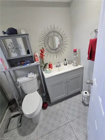Bathroom featuring vanity and toilet