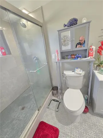 Bathroom with toilet and walk in shower