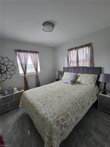 Bedroom featuring dark hardwood / wood-style floors