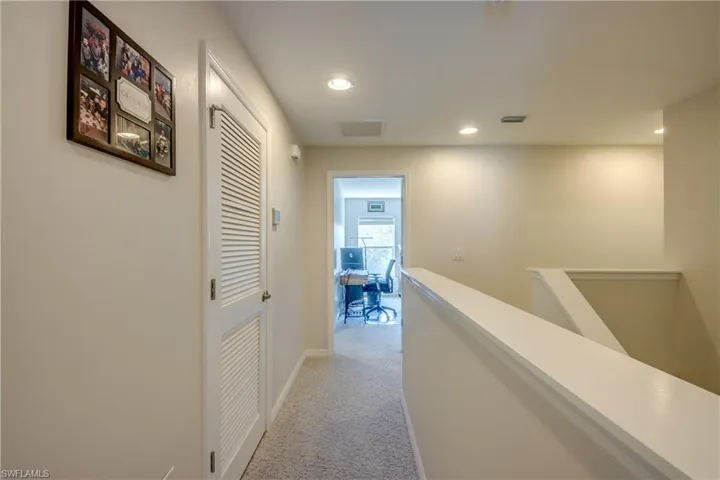 Stairway to 3 bedrooms, 2 full bathrooms, and laundry.