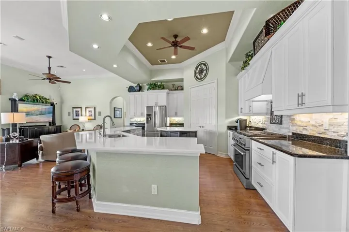 Breakfast bar, island, gas stove, updated cabinets and countertops.