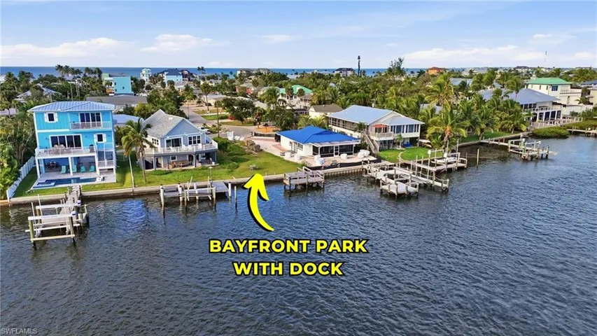 Aerial view of residential area with a nearby body of water - Virtually Edited Image