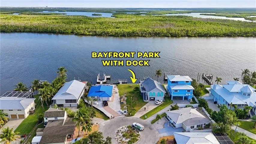 Aerial view of residential area featuring a large body of water - Virtually Edited Image
