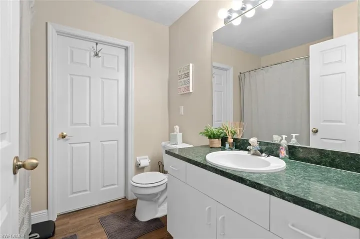Bathroom featuring toilet, tub/shower  and vanity