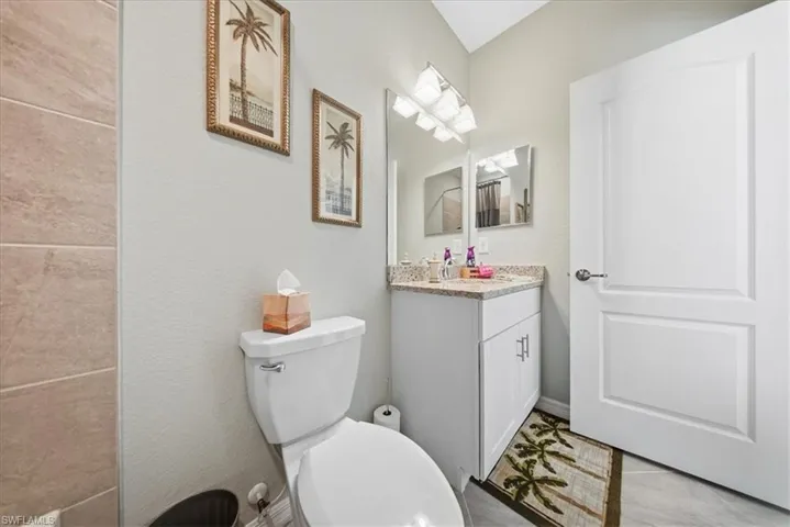 Half bath with vanity and toilet