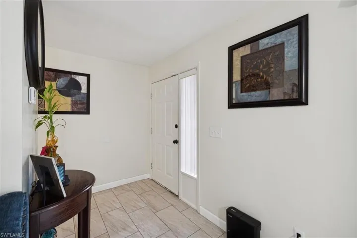 Entryway featuring light tile patterned flooring