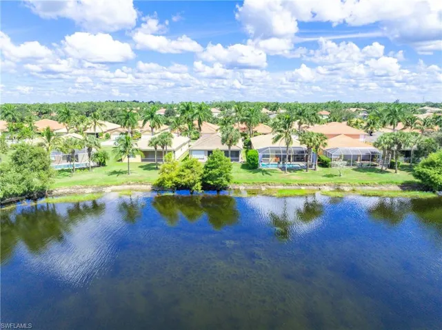 Aerial view featuring a rear water view