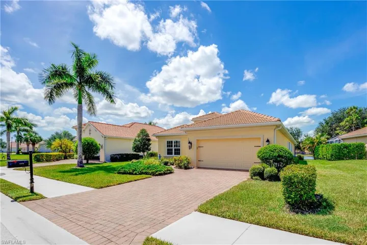 Front of home with paver driveway