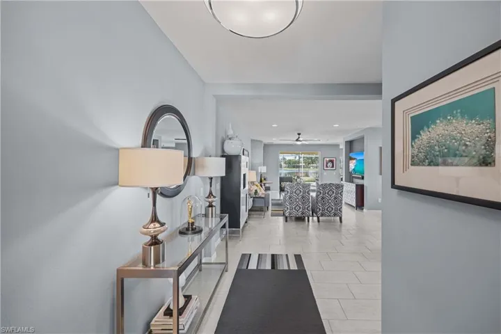Hallway featuring light tile patterned floors - What you see as you walk in