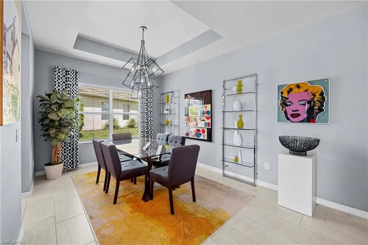 Dining room featuring a coiffured ceiling