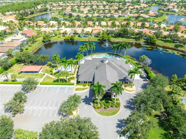 Birds eye view of the clubhouse featuring a water view